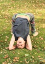 Girl exercising yoga on meadow Royalty Free Stock Photo