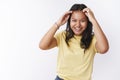 Girl expressing positive vibes with good mood, checking haircut while dancing smiling broadly from happiness and joy Royalty Free Stock Photo