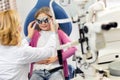 Girl at eye specialist controls vision Royalty Free Stock Photo