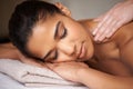 Girl, eyes closed or hands for back massage in hotel to relax for zen resting or wellness physical therapy. Face of