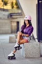 Girl fall down and scratch the leg after rollerblading Royalty Free Stock Photo
