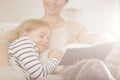 Girl falling asleep while reading book Royalty Free Stock Photo