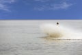 Girl falling jumping into the water with big splash. Nature recreation concept . Royalty Free Stock Photo