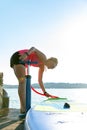 Girl family man woman are doing yoga on a sup Royalty Free Stock Photo