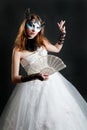 Girl with fan and mask in white dress Royalty Free Stock Photo