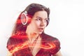 Girl fan sings and dances listening to music. Young brunette woman in big headphones enjoys music Royalty Free Stock Photo