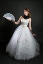 Girl with fan in white dress Royalty Free Stock Photo