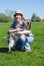 The Girl-farmer and young goat. Royalty Free Stock Photo