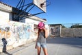 Girl fashion with a fedora hat on his head in the urban scene Royalty Free Stock Photo