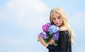 Girl fashion model carry hydrangea flowers. Spring fresh bouquet. Flowers tender spring fragrance. Bouquet for