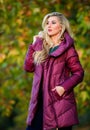 Girl fashionable blonde walk autumn park. Jackets everyone should have. How pick jacket. Puffer fashion concept