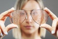 Girl with fashionable glasses. water drops visible