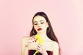 Girl with fashionable makeup with banana.