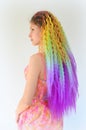 A girl with a fashionable set of multicolored braids Kanekalon. Colored artificial strands of hair. Royalty Free Stock Photo