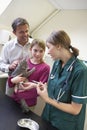 Girl And Father Taking Cat For Examination By Vet Royalty Free Stock Photo