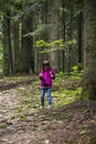 A girl feeding a carpathian squirell in the forest, Skole Beskids National Nature Park, Ukraine Royalty Free Stock Photo