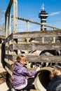 Girl feeding goat in zoo