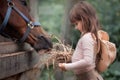 Girl feeding her horse Royalty Free Stock Photo