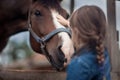 Girl feeding her horse Royalty Free Stock Photo