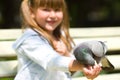 Girl Feeding Pigeon Royalty Free Stock Photo