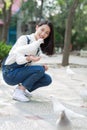 Girl feeding pigeons Royalty Free Stock Photo