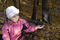 The girl feeds birds. Royalty Free Stock Photo