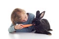 Girl feeds pet rabbit