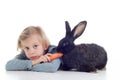 Girl feeds pet rabbit