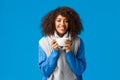 Girl feeling better after comming home and brewing delicious cup tea. Attractive smiling african-american happy woman Royalty Free Stock Photo