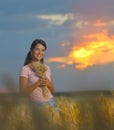 Girl feeling free in a beautiful wheat field Royalty Free Stock Photo