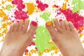 Girl feet with rainbow colorful nails