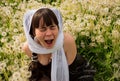 A girl felt a tickle of dandelions Royalty Free Stock Photo