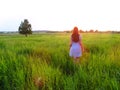Girl in a field at dawn