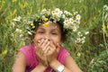 Girl in field flower garland Royalty Free Stock Photo