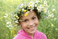 Girl in field flower garland Royalty Free Stock Photo