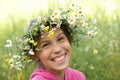 Girl in field flower garland Royalty Free Stock Photo