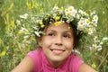 Girl in field flower garland Royalty Free Stock Photo