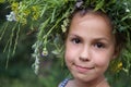 Girl in field flower garland Royalty Free Stock Photo