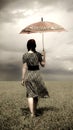 Girl at field with umbrella