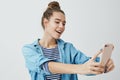 Girl finding angle take awesome selfie post online internet. Attractive stylish fashionable woman making selfie Royalty Free Stock Photo