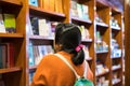 A girl finding book in the store