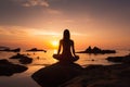 A girl finds serenity practicing yoga on the beach during a tranquil sunrise Royalty Free Stock Photo
