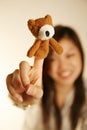 Girl with finger puppet bear