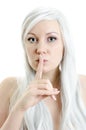Girl with a finget at lips Royalty Free Stock Photo