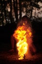 Girl fire dancing performance at outdoor art festival, smooth movements of female artist