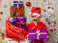 Girl with fireworks rolling in from the eyes is a gift from bag of Christmas gifts Royalty Free Stock Photo