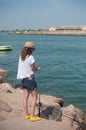 Girl fishing on the beach