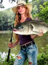 Girl fishing morning with holding lot of big fishes. Royalty Free Stock Photo