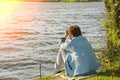 Girl with fishing rod fishing in the pond Royalty Free Stock Photo