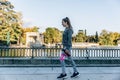 Girl with fitness sportswear walks through a beautiful park
